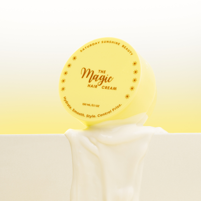 Hair milk. Yellow container of Magic Cream showing texture